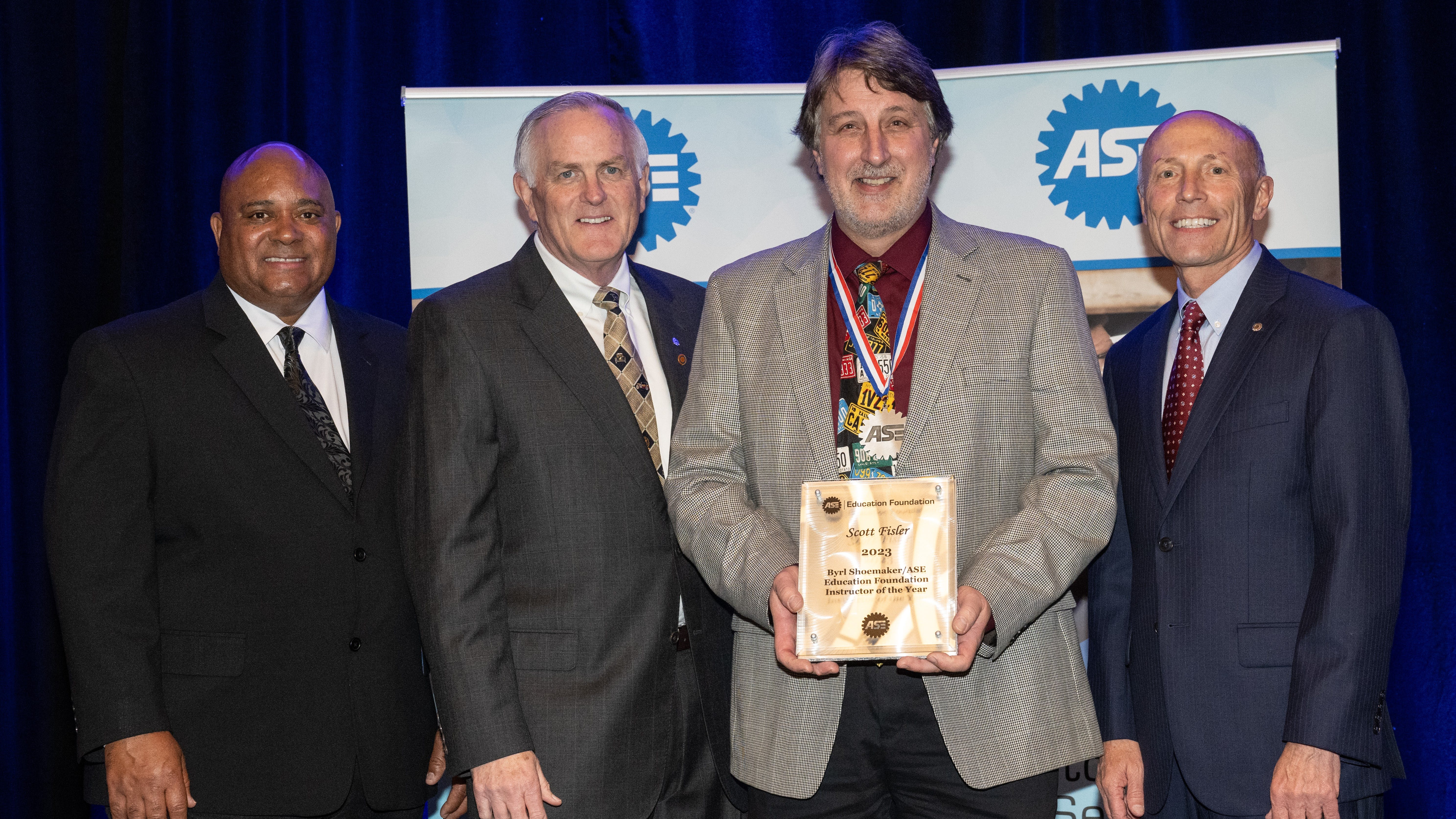 (L-R) - Homer Hogg, chair, ASE; Mike Coley, president, ASE Education Foundation; Scott Fisler, Milwaukee Area Technical College and Tim Zilke, past president and CEO of ASE